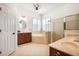 A large main bathroom with soaking tub, walk-in shower, and double sink vanities at 16170 Colchester Palms Dr, Tampa, FL 33647