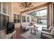 Covered patio with comfortable seating, a ceiling fan, and a view of the pool at 16170 Colchester Palms Dr, Tampa, FL 33647
