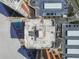 Aerial view of a condo building with a rooftop, pool, and parking at 17920 Gulf Blvd # 208, Redington Shores, FL 33708