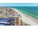 Scenic aerial view of the coastline, showcasing the city, sandy beach, and oceanfront property at 17920 Gulf Blvd # 208, Redington Shores, FL 33708