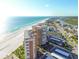 Panoramic aerial view showcasing the beachfront condo, coastline, and city at 17920 Gulf Blvd # 208, Redington Shores, FL 33708