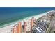 Aerial view of a beachfront condominium complex next to a beautiful beach and ocean at 17920 Gulf Blvd # 208, Redington Shores, FL 33708
