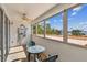Relaxing balcony with a table set, ceiling fan, and stunning ocean views at 17920 Gulf Blvd # 208, Redington Shores, FL 33708