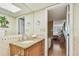 Bathroom view showcasing the granite countertop, vanity, and access to the bedroom, all bathed in natural light at 17920 Gulf Blvd # 208, Redington Shores, FL 33708