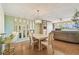Open dining area with chandelier and views into the kitchen and living areas at 17920 Gulf Blvd # 208, Redington Shores, FL 33708