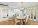 Bright dining area featuring a light fixture and a view into the kitchen at 17920 Gulf Blvd # 208, Redington Shores, FL 33708