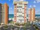 Aerial view of condo community near the beach with circular driveway at 17920 Gulf Blvd # 208, Redington Shores, FL 33708