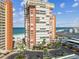 Oceanfront condo community showing well-maintained landscaping and parking at 17920 Gulf Blvd # 208, Redington Shores, FL 33708