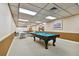 Well-lit game room featuring a pool table, tables and chairs, and ample space for recreation at 17920 Gulf Blvd # 208, Redington Shores, FL 33708