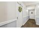 Hallway with carpet and grey paint leading to condo doors at 17920 Gulf Blvd # 208, Redington Shores, FL 33708