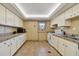 Clean, functional kitchen with white appliances, ample counter space, and practical layout for effortless cooking at 17920 Gulf Blvd # 208, Redington Shores, FL 33708