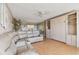 Spacious living room with plush seating, wood floors and decorative accents at 17920 Gulf Blvd # 208, Redington Shores, FL 33708