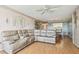 Spacious living room with plush seating and wood floors at 17920 Gulf Blvd # 208, Redington Shores, FL 33708