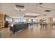 Large common area with seating, tables, and stunning ocean views from expansive windows at 17920 Gulf Blvd # 208, Redington Shores, FL 33708