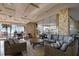 Comfortable lounge area with stylish sofas, chairs, and scenic ocean views through large windows at 17920 Gulf Blvd # 208, Redington Shores, FL 33708