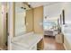 The main bedroom offers a vanity area, closet and a glimpse into the well-lit bedroom with large windows at 17920 Gulf Blvd # 208, Redington Shores, FL 33708