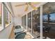 Spacious covered patio with ceiling fans and sliding glass doors, providing seamless indoor-outdoor living at 17920 Gulf Blvd # 208, Redington Shores, FL 33708