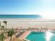 Beautiful beachside pool with lounge chairs, umbrellas, and stunning ocean views for relaxation and enjoyment at 17920 Gulf Blvd # 208, Redington Shores, FL 33708