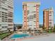 Community pool with beach access and an outdoor entertainment area at 17920 Gulf Blvd # 208, Redington Shores, FL 33708