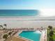 Outdoor pool overlooking a pristine beach and clear ocean waters at 17920 Gulf Blvd # 208, Redington Shores, FL 33708