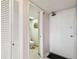 Powder room with a white door, tile flooring, and a toilet with cactus decor at 17920 Gulf Blvd # 208, Redington Shores, FL 33708