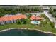 Aerial view of complex with pool, parking and landscaping at 18107 Peregrines Perch Pl # 6303, Lutz, FL 33558