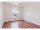 An airy bedroom with lots of light and hardwood floors, and a lovely view from the window at 18107 Peregrines Perch Pl # 6303, Lutz, FL 33558