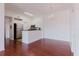 Open kitchen with stainless steel appliances and bright lighting at 18107 Peregrines Perch Pl # 6303, Lutz, FL 33558