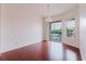 Living area with balcony access featuring lovely view at 18107 Peregrines Perch Pl # 6303, Lutz, FL 33558
