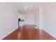 Open floor plan with wood floors and modern lighting at 18107 Peregrines Perch Pl # 6303, Lutz, FL 33558