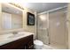 Bathroom features a marble countertop, new vanity, and glass shower enclosure at 1905 Oyster Catcher Ln # 924, Clearwater, FL 33762