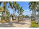 Gated entrance to a quiet community surrounded by lush palm trees at 1905 Oyster Catcher Ln # 924, Clearwater, FL 33762