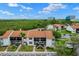 Charming condo complex showcasing well-maintained grounds, sidewalks, and a shared parking area at 1905 Oyster Catcher Ln # 924, Clearwater, FL 33762
