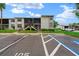 Well-maintained condominium complex features a shared parking area and landscaped grounds at 1905 Oyster Catcher Ln # 924, Clearwater, FL 33762
