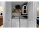 Laundry room features a newer washer and dryer with ample shelving at 1905 Oyster Catcher Ln # 924, Clearwater, FL 33762
