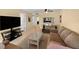 Living room with neutral paint, comfortable seating, tile flooring, and a tv at 1905 Oyster Catcher Ln # 924, Clearwater, FL 33762