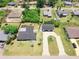Aerial view showcases the home's layout, including a large yard and separate garage at 20295 Lorenzo Ave, Port Charlotte, FL 33952