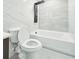 Bathroom featuring a shower and tub combination with marbled tile surround, and modern matte black fixtures at 20295 Lorenzo Ave, Port Charlotte, FL 33952