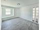 This bedroom has tile floors and natural light that comes from the window at 20295 Lorenzo Ave, Port Charlotte, FL 33952