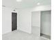 Bedroom with mirrored closet doors, and dark interior doors at 20295 Lorenzo Ave, Port Charlotte, FL 33952