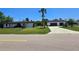 Charming single story home featuring a spacious lawn and a two car garage at 20295 Lorenzo Ave, Port Charlotte, FL 33952