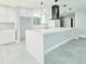 Stylish kitchen with modern cabinetry, a large center island, and stainless range hood at 20295 Lorenzo Ave, Port Charlotte, FL 33952
