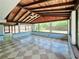 Bright sun room with tiled floor, tongue and groove ceilings and many windows to the outside at 20295 Lorenzo Ave, Port Charlotte, FL 33952