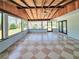 Bright sun room with tiled floor, tongue and groove ceilings and many windows to the outside at 20295 Lorenzo Ave, Port Charlotte, FL 33952