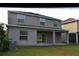 Backyard featuring a covered patio and green lawn at 20420 Carolina Cherry Ct, Tampa, FL 33647