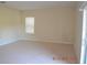 Bright and airy bedroom with plush carpeting, neutral walls, and a large window with blinds at 20420 Carolina Cherry Ct, Tampa, FL 33647