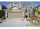 Charming two-story home with a well-manicured lawn and a spacious two-car garage at 20420 Carolina Cherry Ct, Tampa, FL 33647