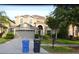 Two-story home with a two-car garage, complemented by a well-maintained lawn and a welcoming front entrance at 20420 Carolina Cherry Ct, Tampa, FL 33647