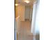 Hallway with carpet flooring and white trim throughout at 20420 Carolina Cherry Ct, Tampa, FL 33647