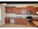 Stylish kitchen featuring granite countertops, stainless steel appliances, and custom cabinetry at 20420 Carolina Cherry Ct, Tampa, FL 33647